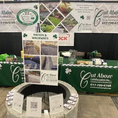 Cut Above Landscaping Inc. display showcasing patios, walkways, and outdoor living spaces with Unilock pavers.